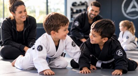 Young kids smiling during a Brazilian Jiu-Jitsu class at Gracie Lake Norman in Mooresville, NC